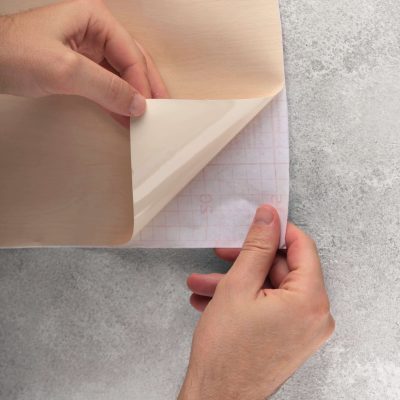 Hands putting up decorative vinyl flat lay